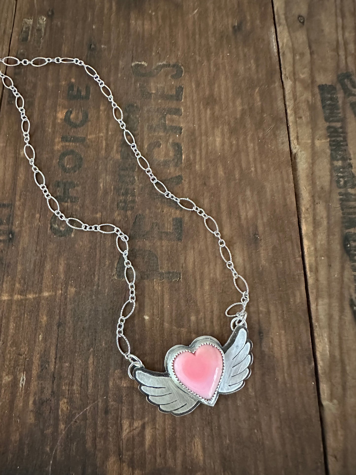 Winged heart necklace